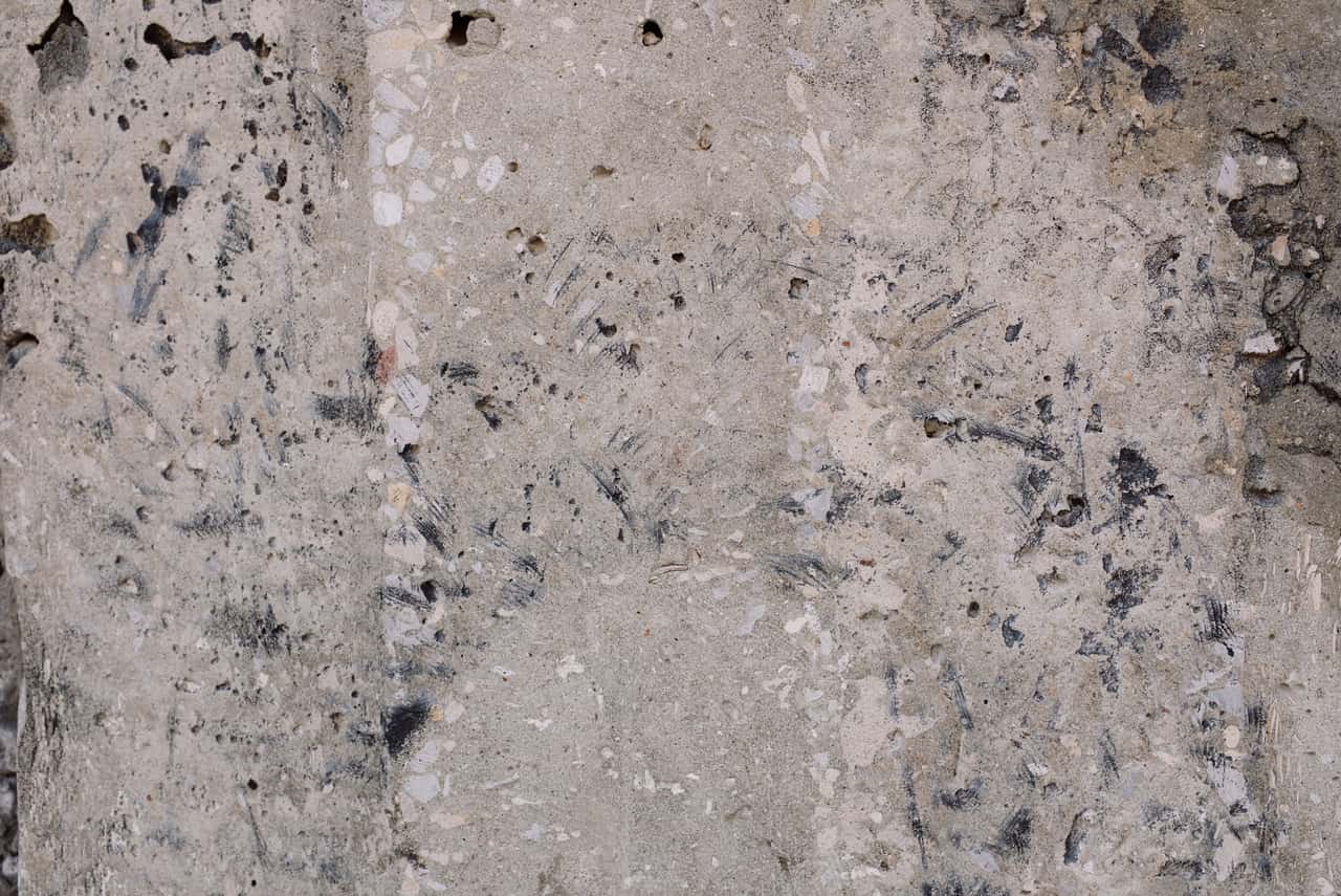 Close view of a concrete surface showing weathering and surface texture