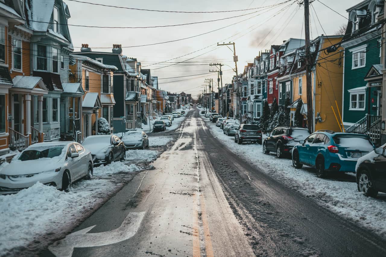 Snow-covered residential street and driveways in winter
