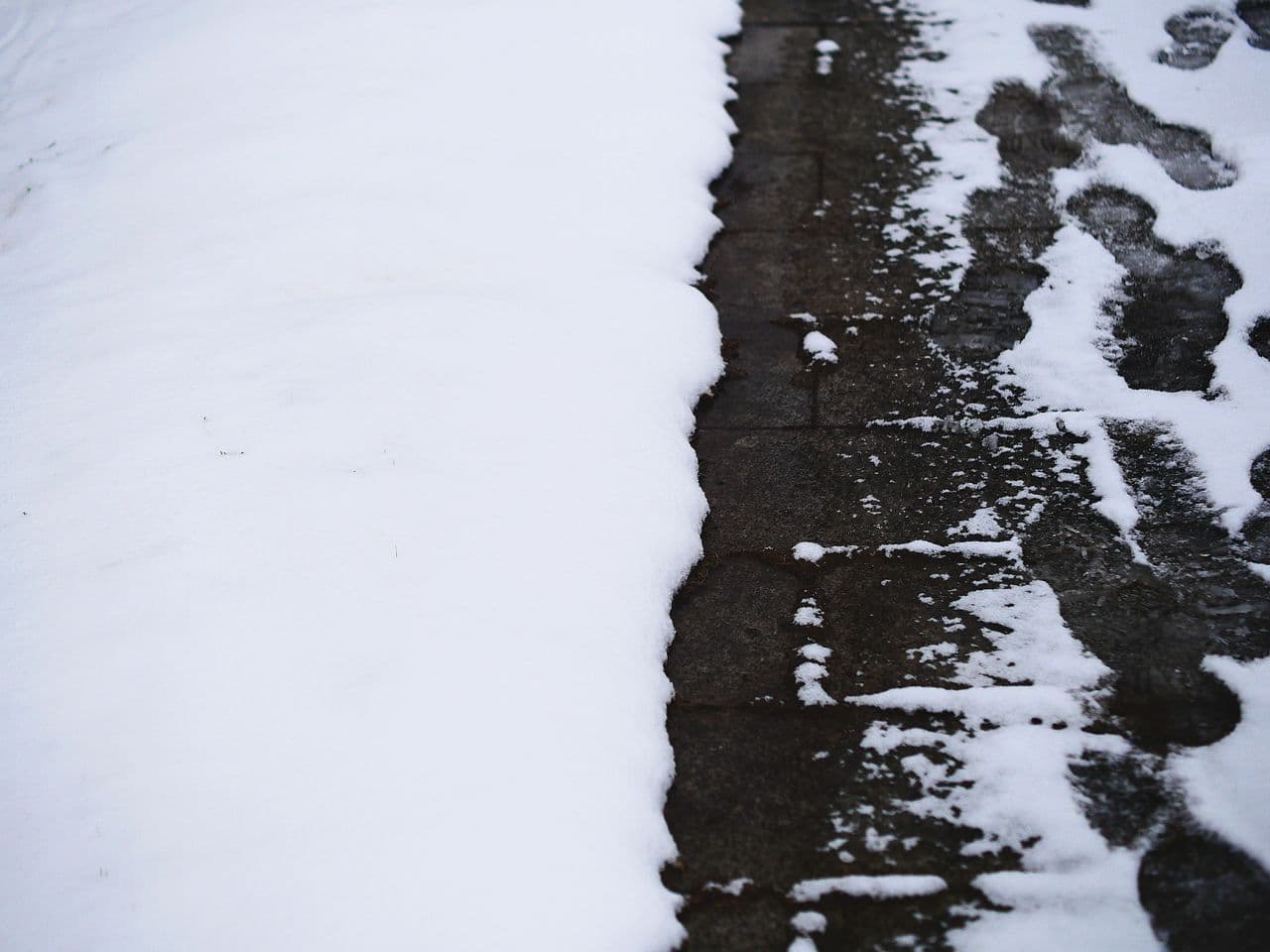 A snow-covered path marked with footprints